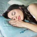 Apple's smart mattress in a bedroom setting with sleep tracking sensors