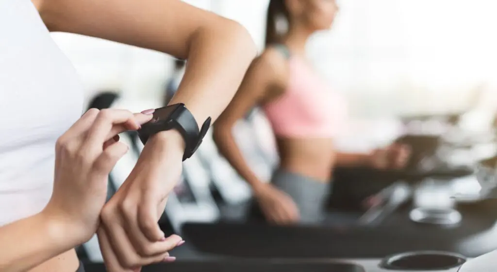 Person using a Mindrose Fitness Tracker during a workout